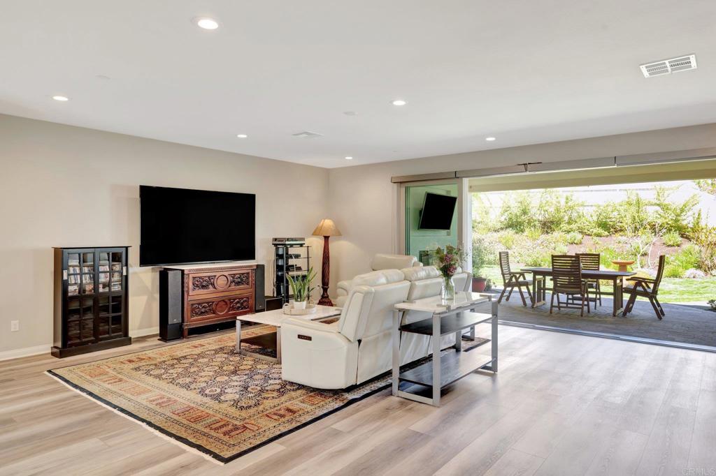 22005 Long Trot Drive Escondido, CA 92029 - Photo 8 of 51 a living room with furniture and a flat screen tv