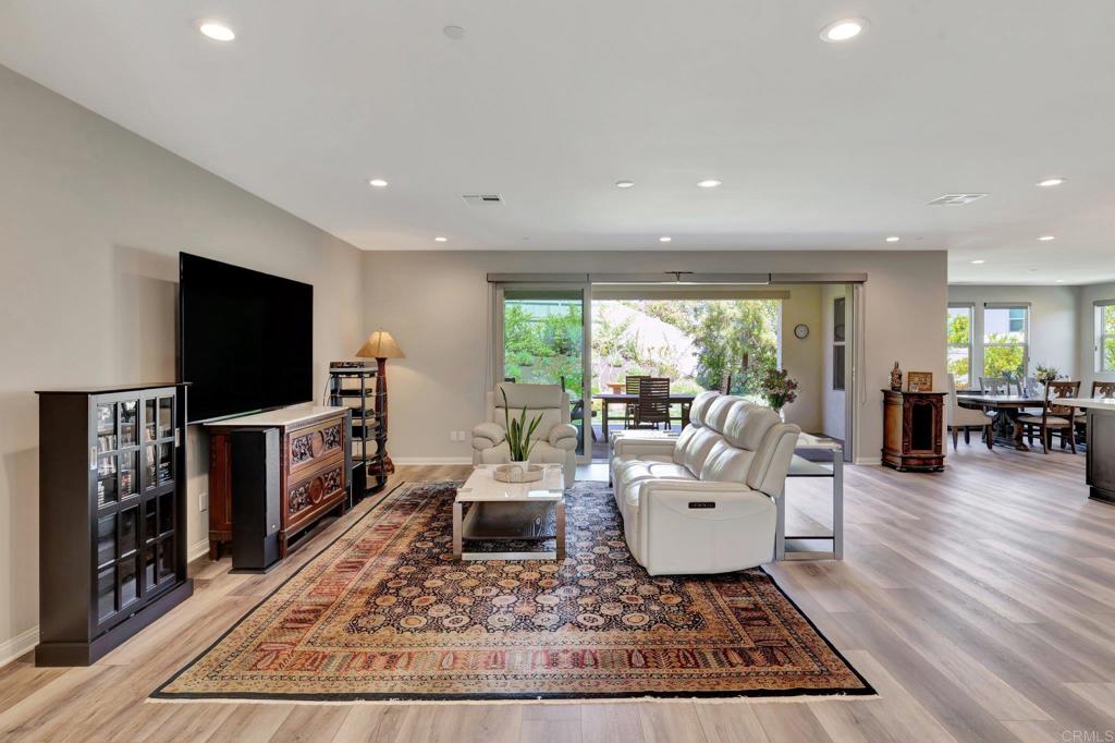 22005 Long Trot Drive Escondido, CA 92029 - Photo 9 of 51 a living room with furniture and a flat screen tv