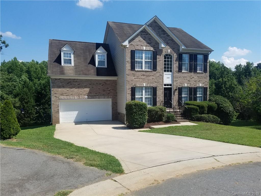 1450 Autumn Ridge Lane Fort Mill, SC 29708 - Photo 2 of 41 a front view of a house with a yard and garage
