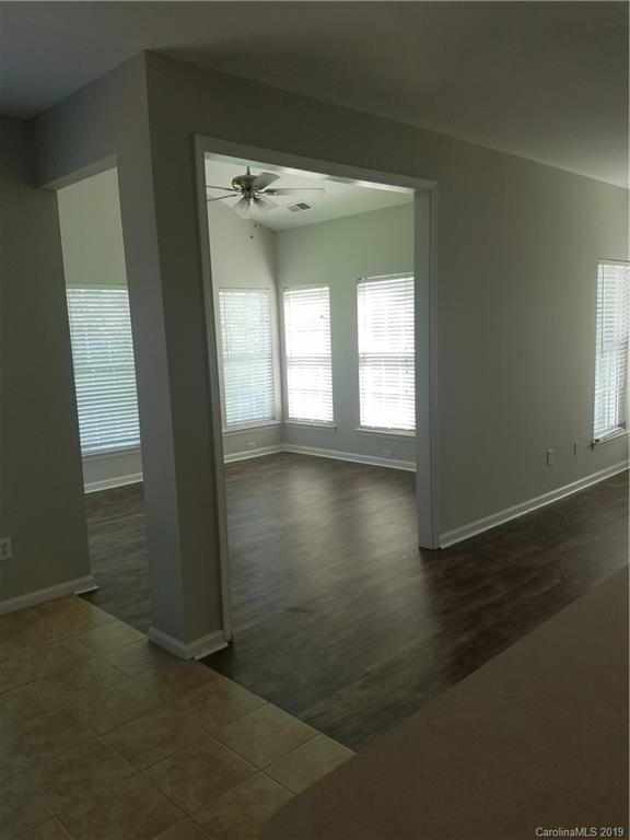 1450 Autumn Ridge Lane Fort Mill, SC 29708 - Photo 17 of 41 an empty room with wooden floor and a window