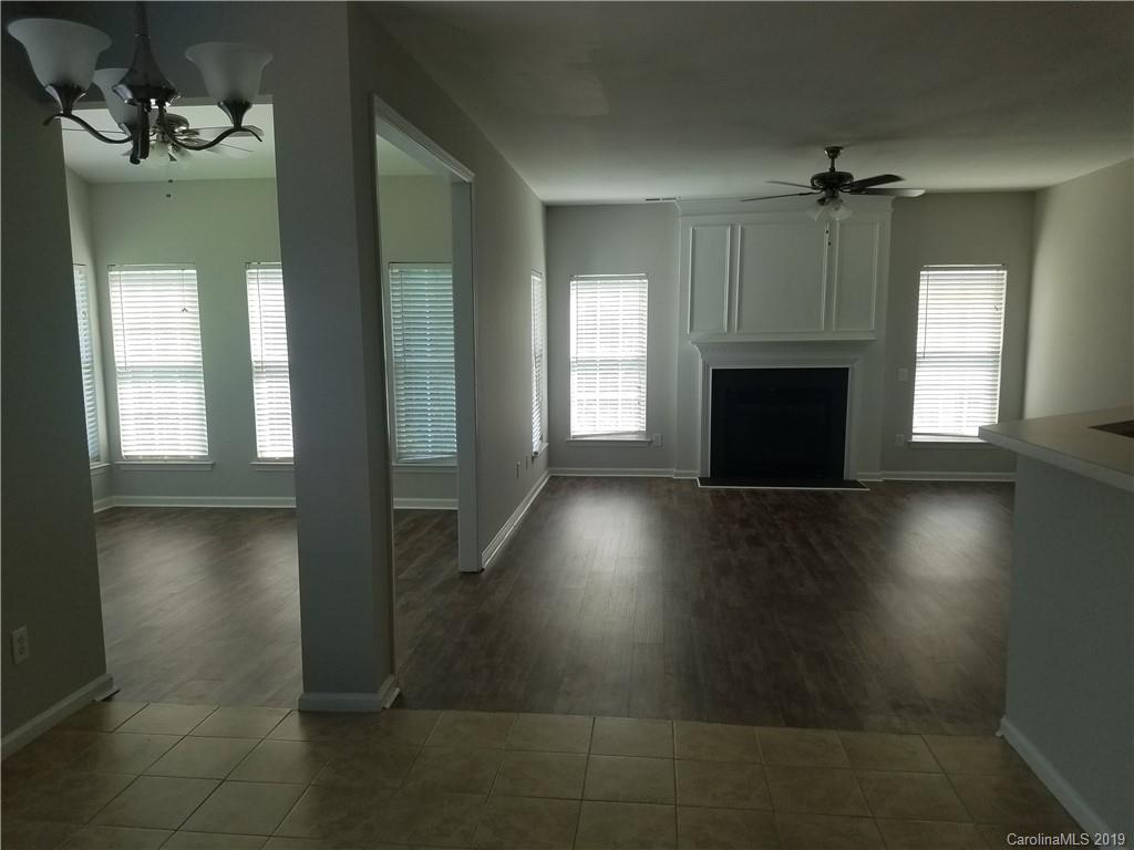 1450 Autumn Ridge Lane Fort Mill, SC 29708 - Photo 18 of 41 an empty room with windows and fireplace
