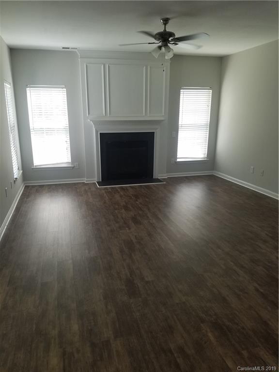 1450 Autumn Ridge Lane Fort Mill, SC 29708 - Photo 19 of 41 an empty room with windows and fireplace