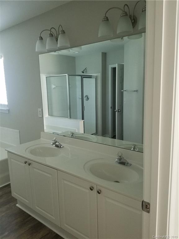 1450 Autumn Ridge Lane Fort Mill, SC 29708 - Photo 37 of 41 a bathroom with a sink and a mirror