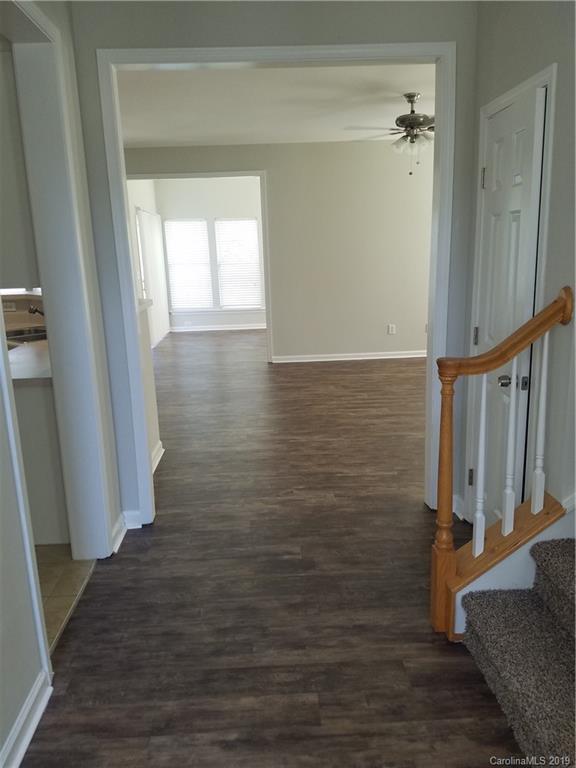 1450 Autumn Ridge Lane Fort Mill, SC 29708 - Photo 9 of 41 a view of an empty room with wooden floor and a window