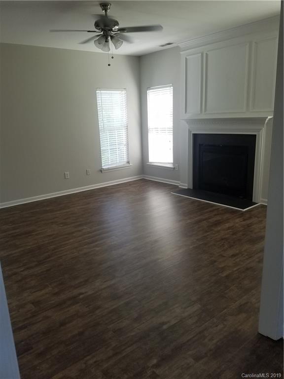1450 Autumn Ridge Lane Fort Mill, SC 29708 - Photo 10 of 41 an empty room with windows and fireplace