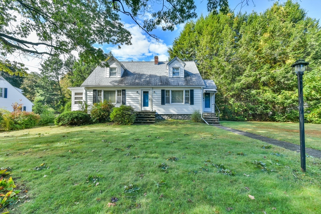 11 Charlton Road Dudley, MA 01571 - Photo 4 of 34 a front view of a house with a yard