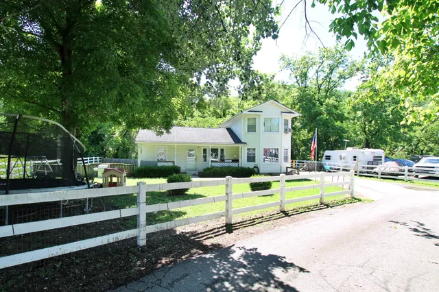 a view of a park with large trees