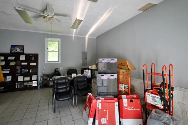 a workspace with furniture and book shelf