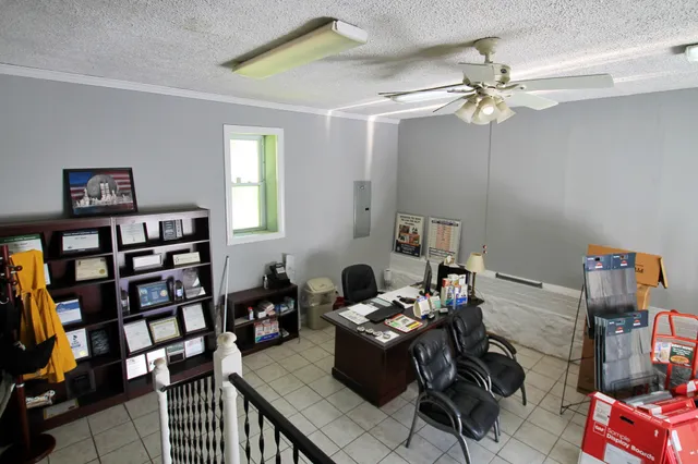 a work room with furniture and a mirror