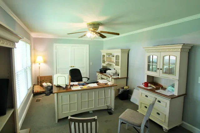 a view of a workspace with furniture