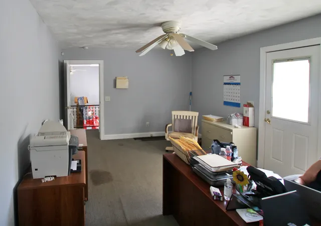 a kitchen with a stove a refrigerator and a sink