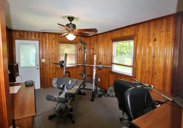 a bathroom with a sink a toilet and shower curtain