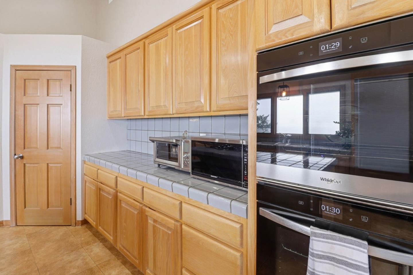 255 Allen Road Woodside, CA 94062 - Photo 11 of 42 a kitchen with stainless steel appliances a stove and a microwave