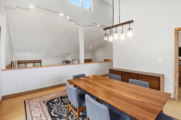 a spacious bedroom with a bed and a couch