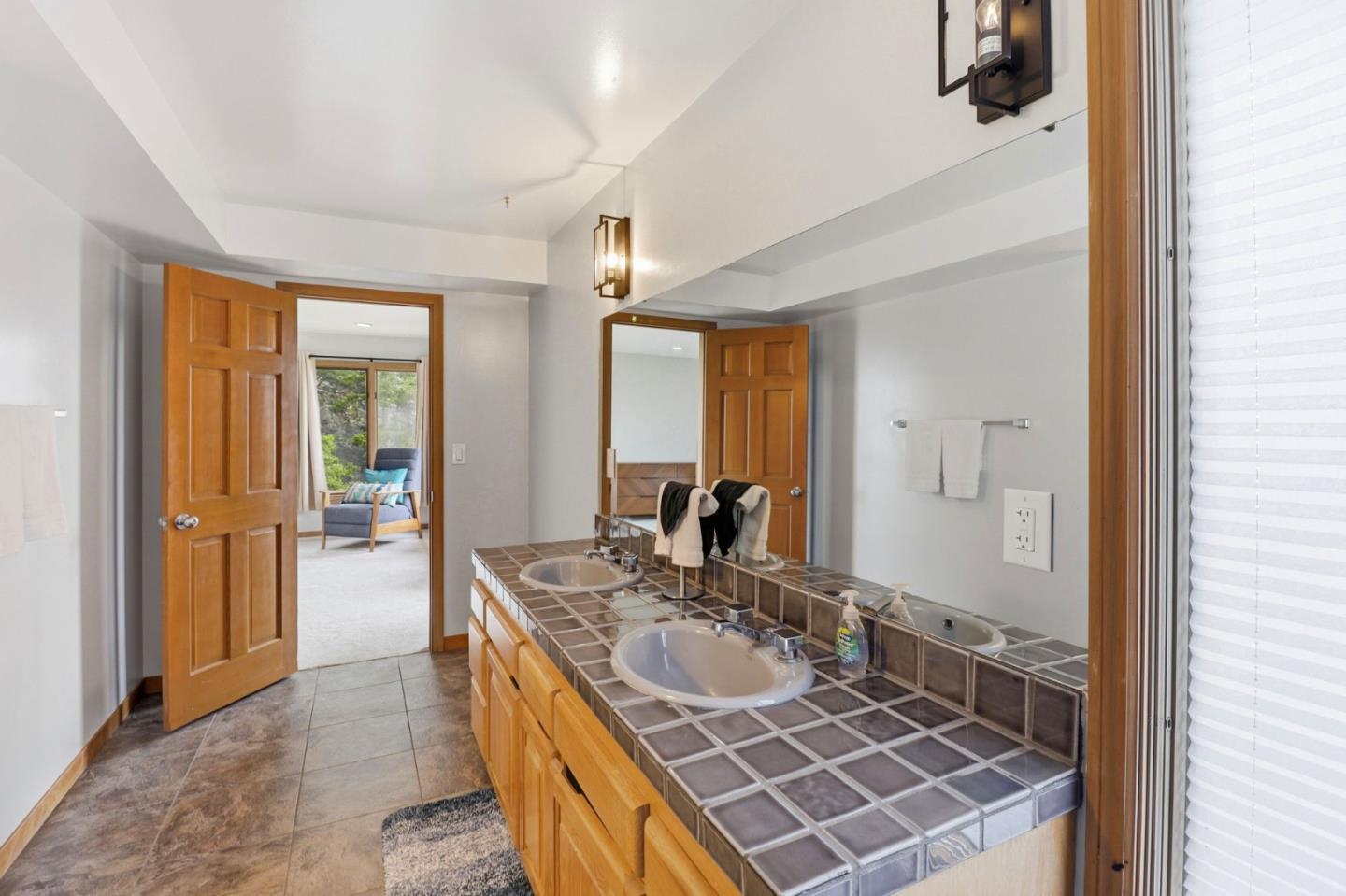 255 Allen Road Woodside, CA 94062 - Photo 21 of 42 a bathroom with a sink and a mirror