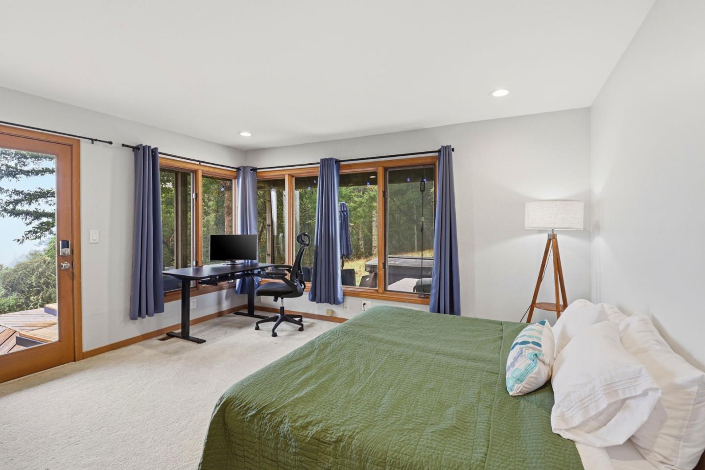 255 Allen Road Woodside, CA 94062 - Photo 24 of 42 a bedroom with a bed and large windows
