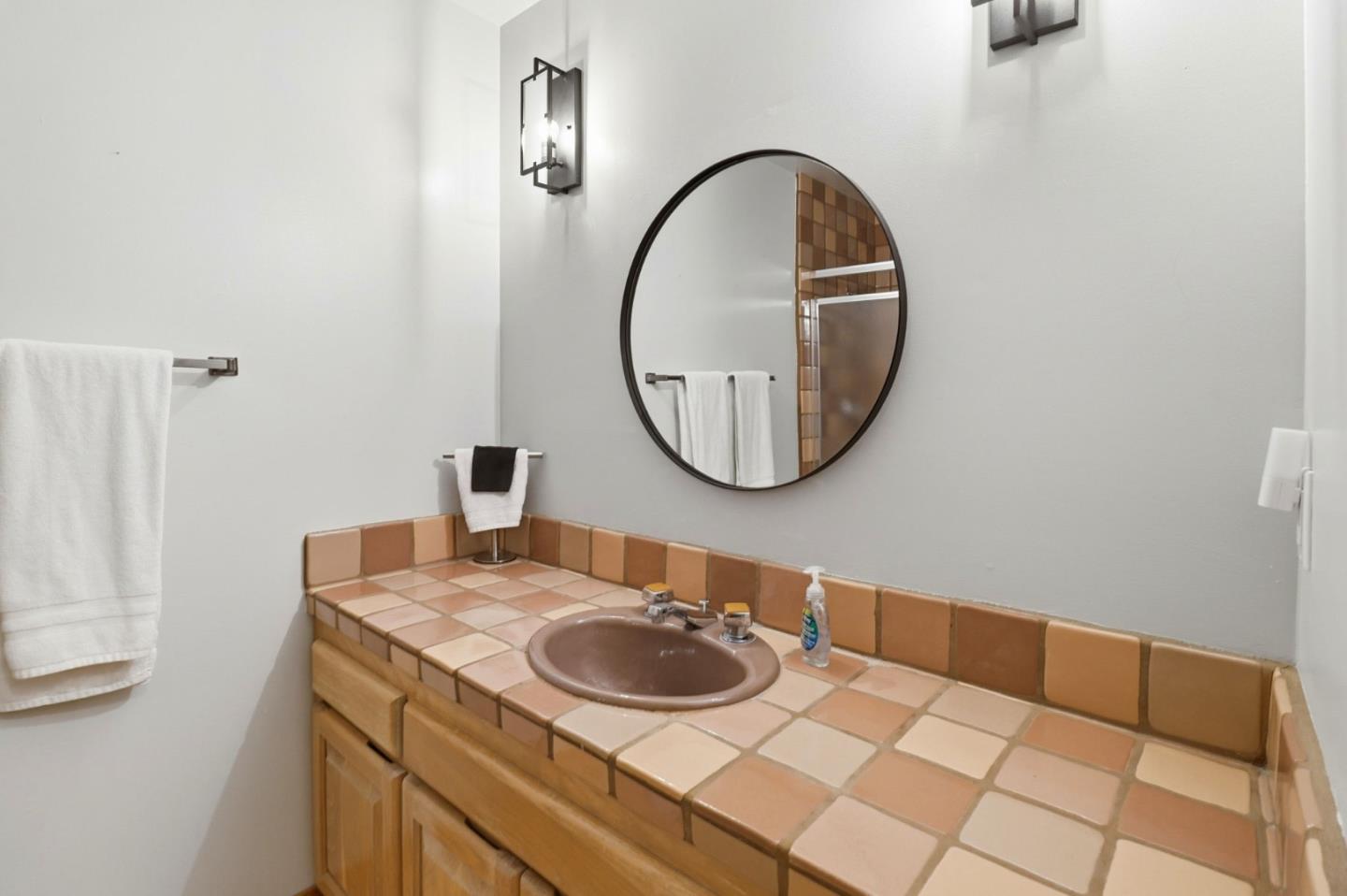 255 Allen Road Woodside, CA 94062 - Photo 26 of 42 a bathroom with a sink and a mirror