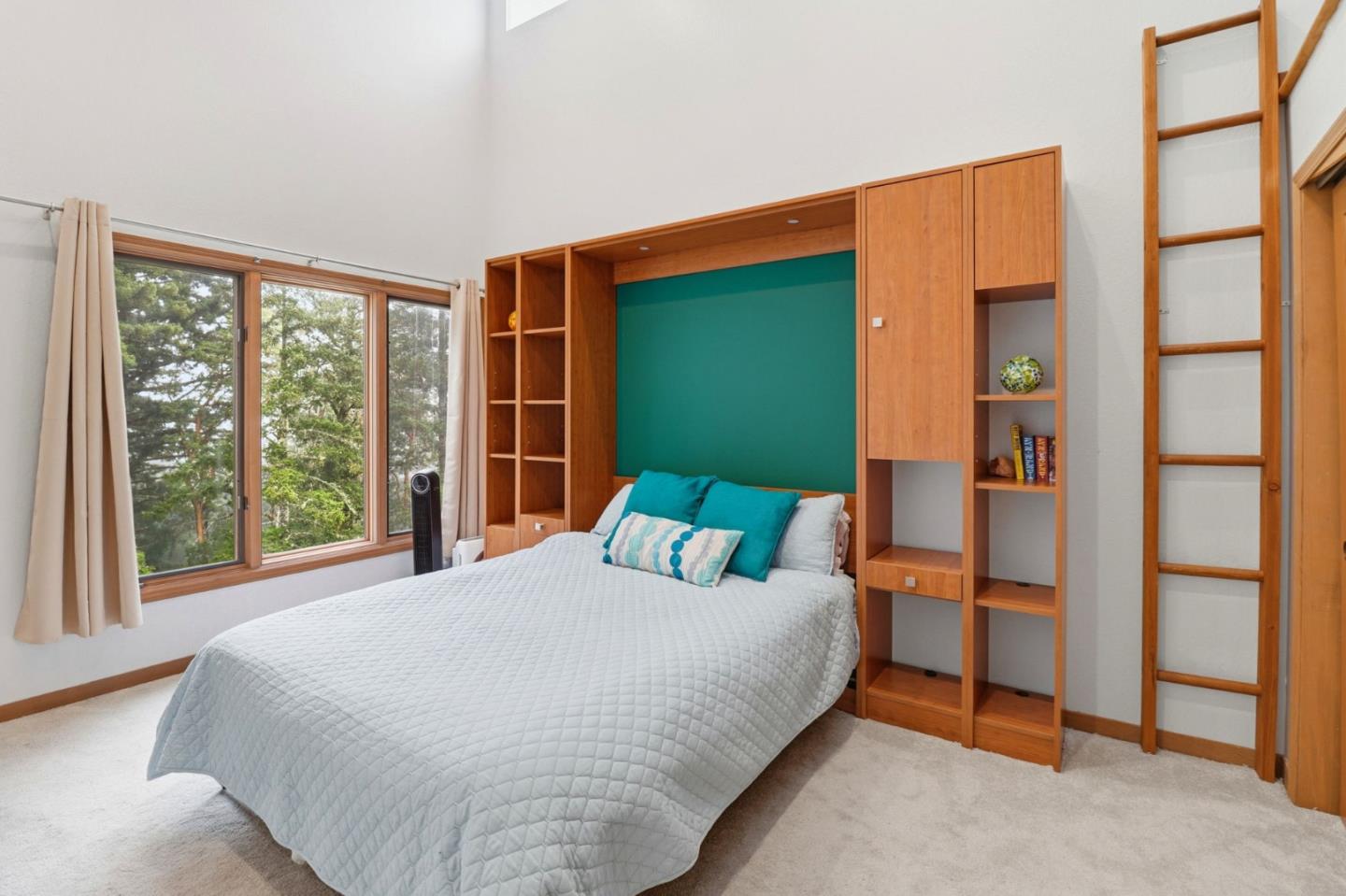 255 Allen Road Woodside, CA 94062 - Photo 27 of 42 a bed sitting in a bedroom next to a window