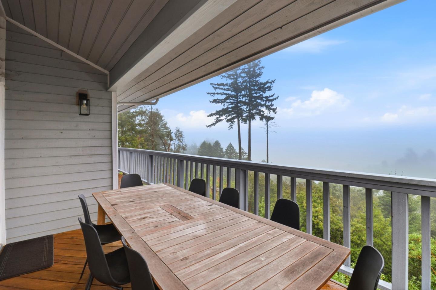 255 Allen Road Woodside, CA 94062 - Photo 33 of 42 a balcony with wooden floor table and chairs