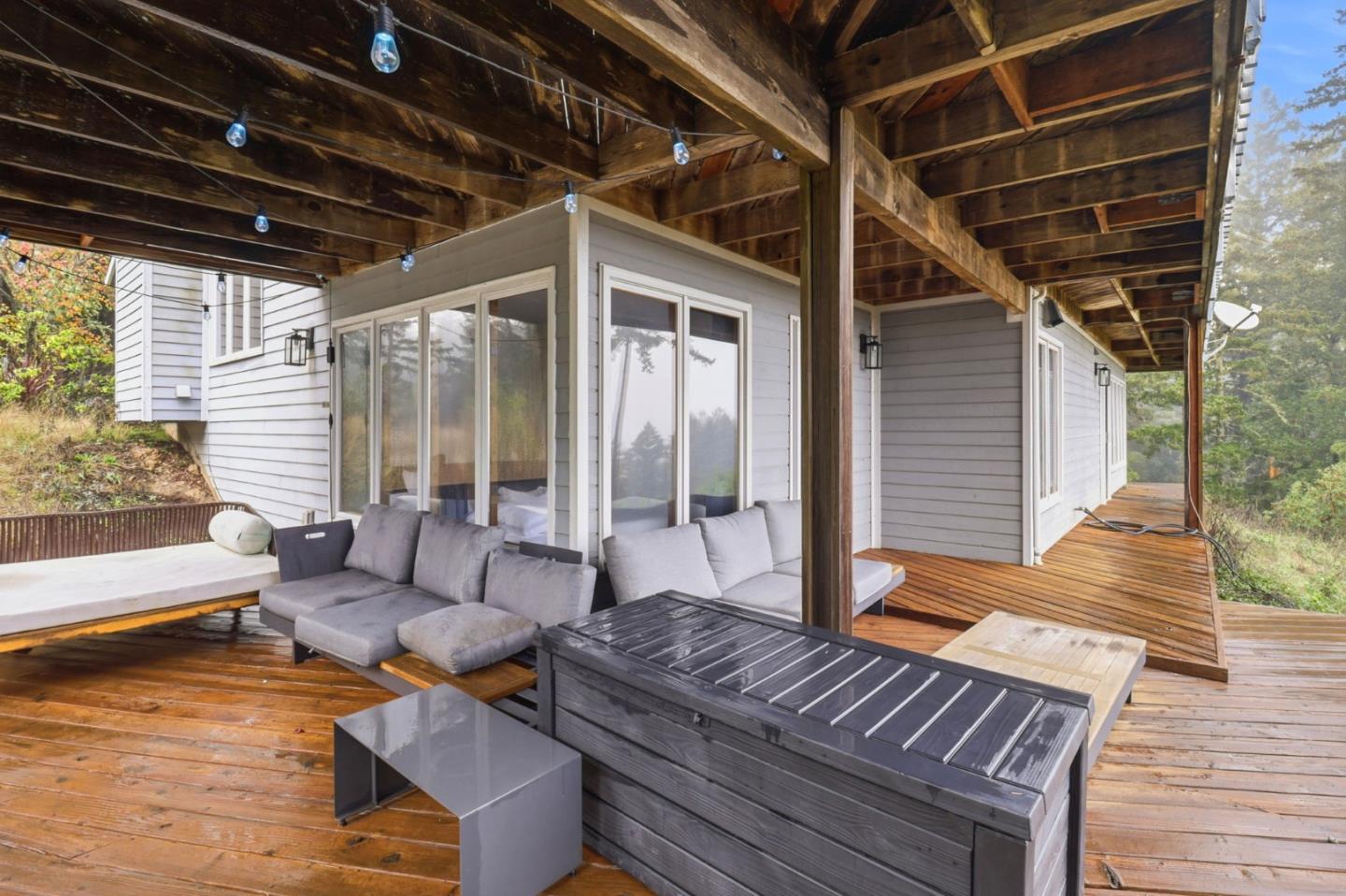 255 Allen Road Woodside, CA 94062 - Photo 37 of 42 a outdoor space with patio the couches and a dining table with the view of swimming pool