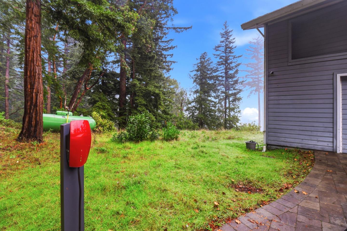 255 Allen Road Woodside, CA 94062 - Photo 41 of 42 a backyard of a house with lots of green space