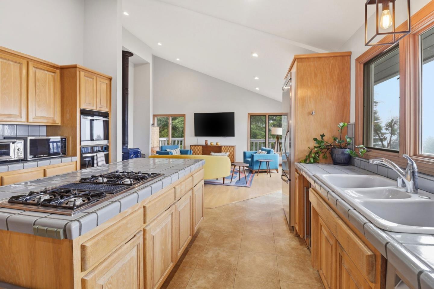 255 Allen Road Woodside, CA 94062 - Photo 7 of 42 a kitchen with stainless steel appliances a sink stove and cabinets