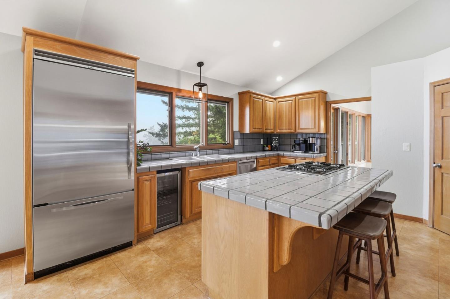 255 Allen Road Woodside, CA 94062 - Photo 9 of 42 a kitchen with a stove a refrigerator and a sink