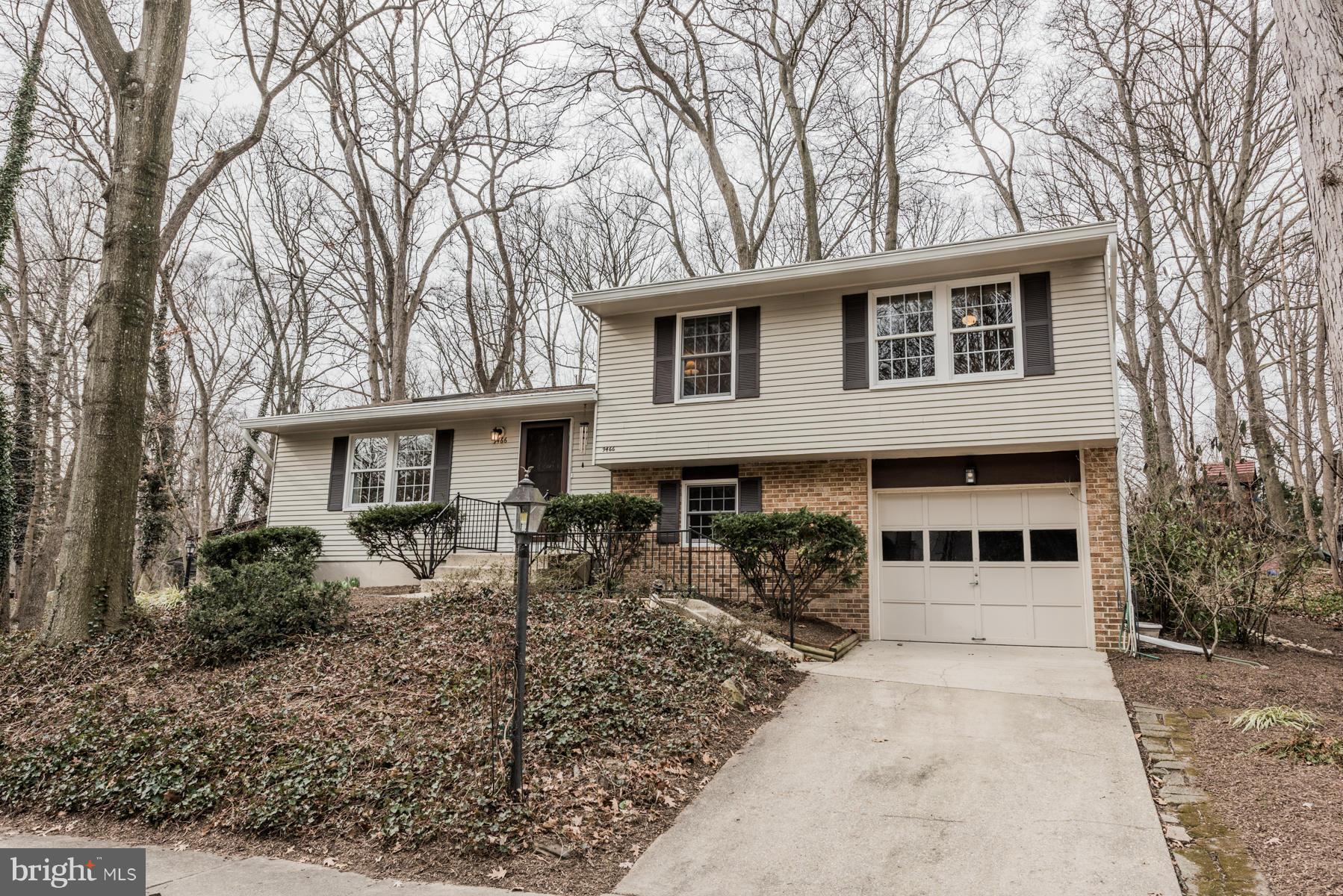 9466 Good Lion Road Columbia, MD 21045 - Photo 1 of 26 a front view of a house with garden