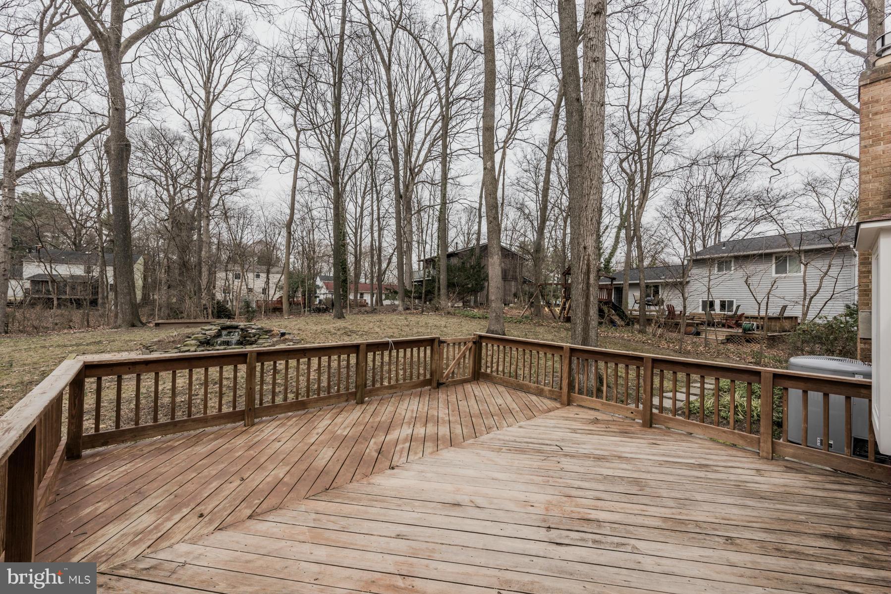 9466 Good Lion Road Columbia, MD 21045 - Photo 11 of 26 a view of deck with trees and wooden fence