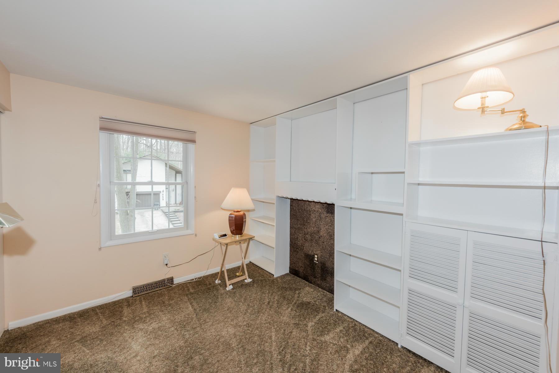 9466 Good Lion Road Columbia, MD 21045 - Photo 20 of 26 a room with a chair and a window