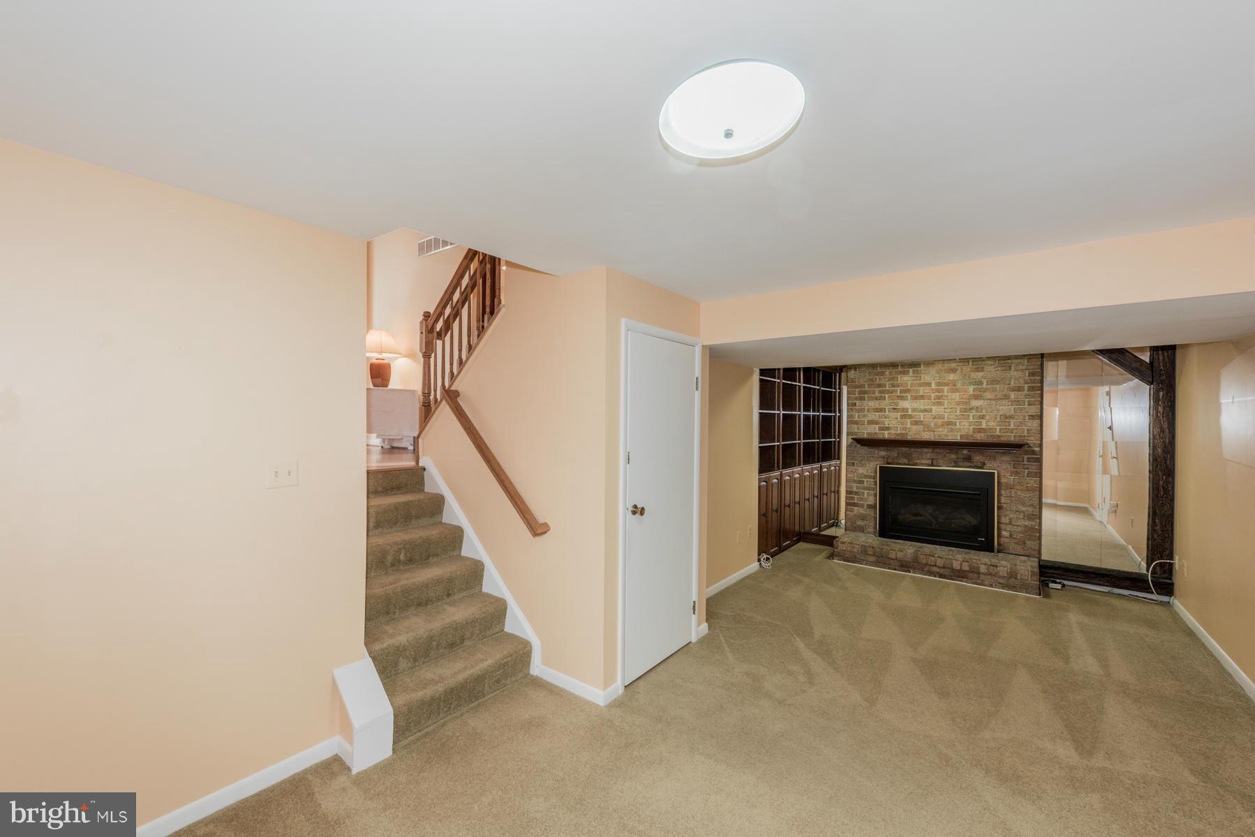 9466 Good Lion Road Columbia, MD 21045 - Photo 21 of 26 a view of a livingroom with a fireplace