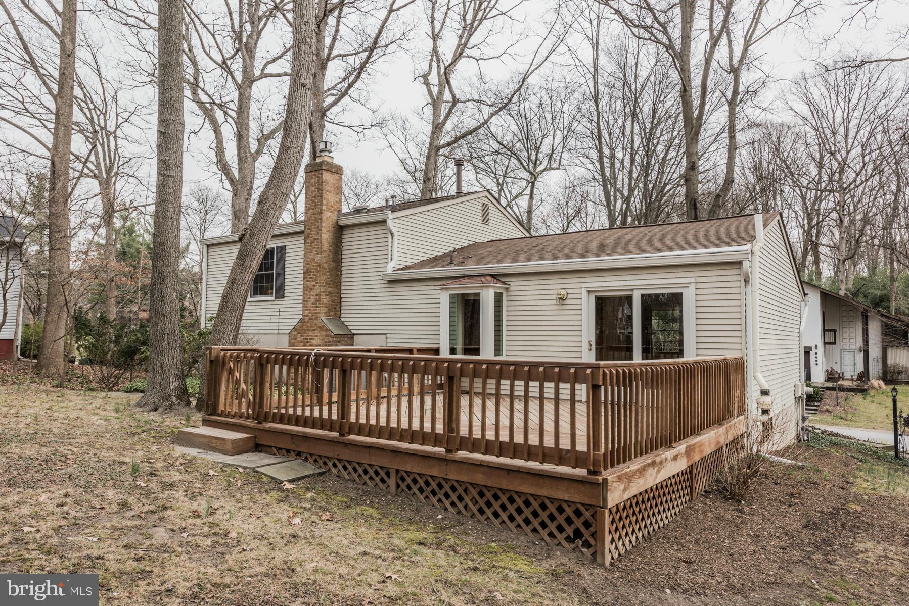 9466 Good Lion Road Columbia, MD 21045 - Photo 4 of 26 a view of a house with a yard and deck