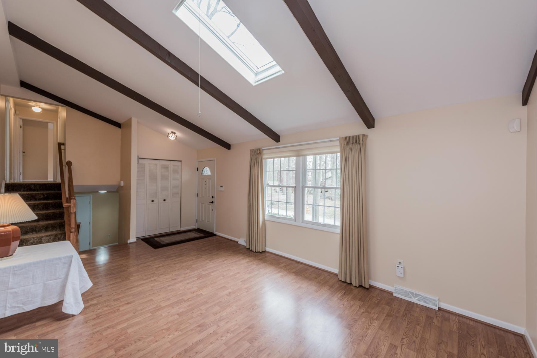 9466 Good Lion Road Columbia, MD 21045 - Photo 6 of 26 an empty room with wooden floor and windows