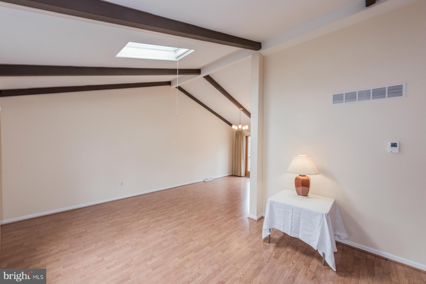 9466 Good Lion Road Columbia, MD 21045 - Photo 7 of 26 a view of an empty room and wooden floor