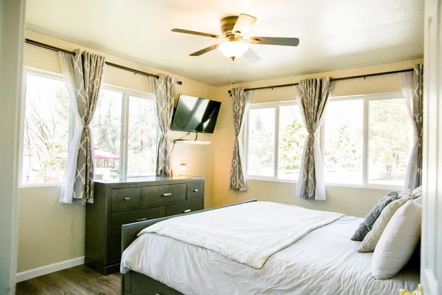 a bed room with a bed and a chandelier