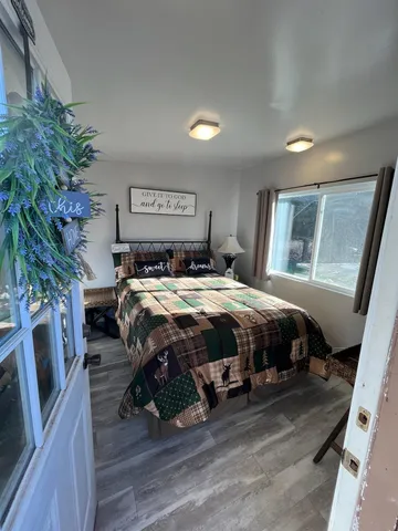 a swimming pool with an outdoor space and seating area