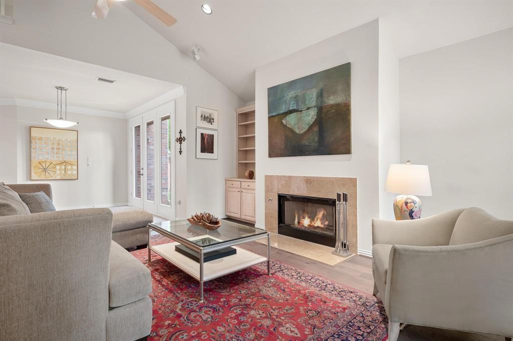 4209 Sexton Lane Dallas, TX 75229 - Photo 10 of 27 a living room with furniture and a fireplace