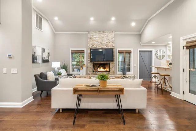 a kitchen with stainless steel appliances granite countertop a refrigerator and a stove top oven