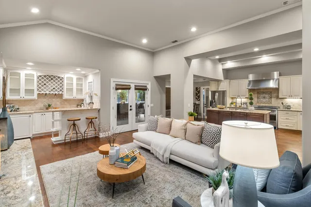 a kitchen with granite countertop stainless steel appliances and wooden cabinets