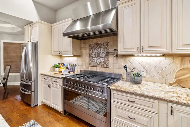 a spacious bathroom with a double vanity sink toilet and shower