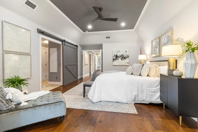 a bathroom with a granite countertop toilet a sink and a mirror