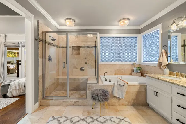 a dining room with furniture and a floor to ceiling window