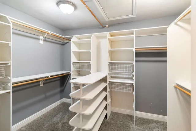 a view of a patio with couches chairs and a umbrella