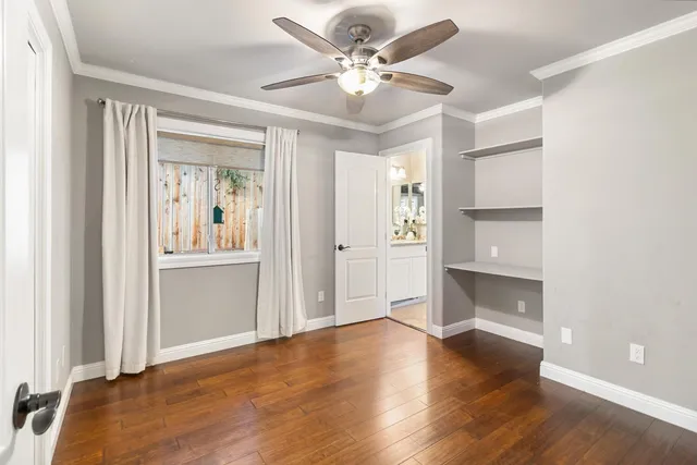 a view of a chairs and table in the backyard