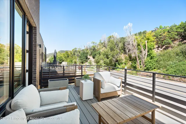 a view of balcony with couches