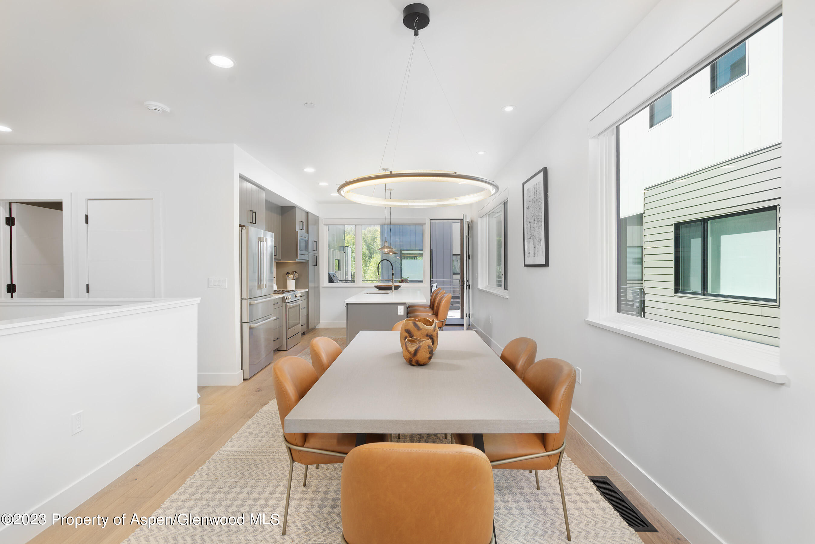 22842 Two Rivers Road, Unit 100 Basalt, CO 81621 - Photo 6 of 22 a view of a dining room with furniture and wooden floor