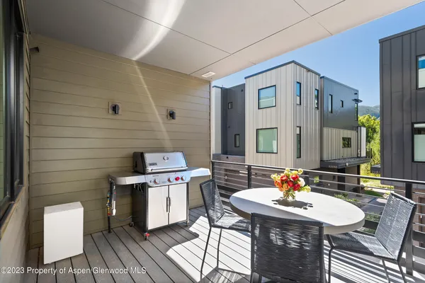 a outdoor space with furniture and mirror