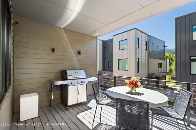 a outdoor space with furniture and mirror