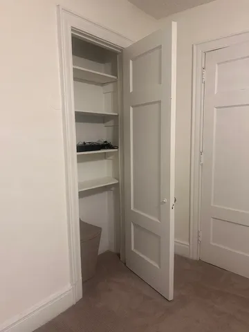 a view of an empty walk in closet