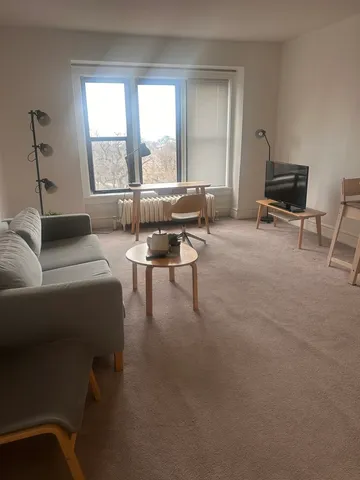 a living room with furniture and a window